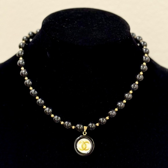 Black and Gold beaded necklace with cc stamped pendant - Picture 1 of 3